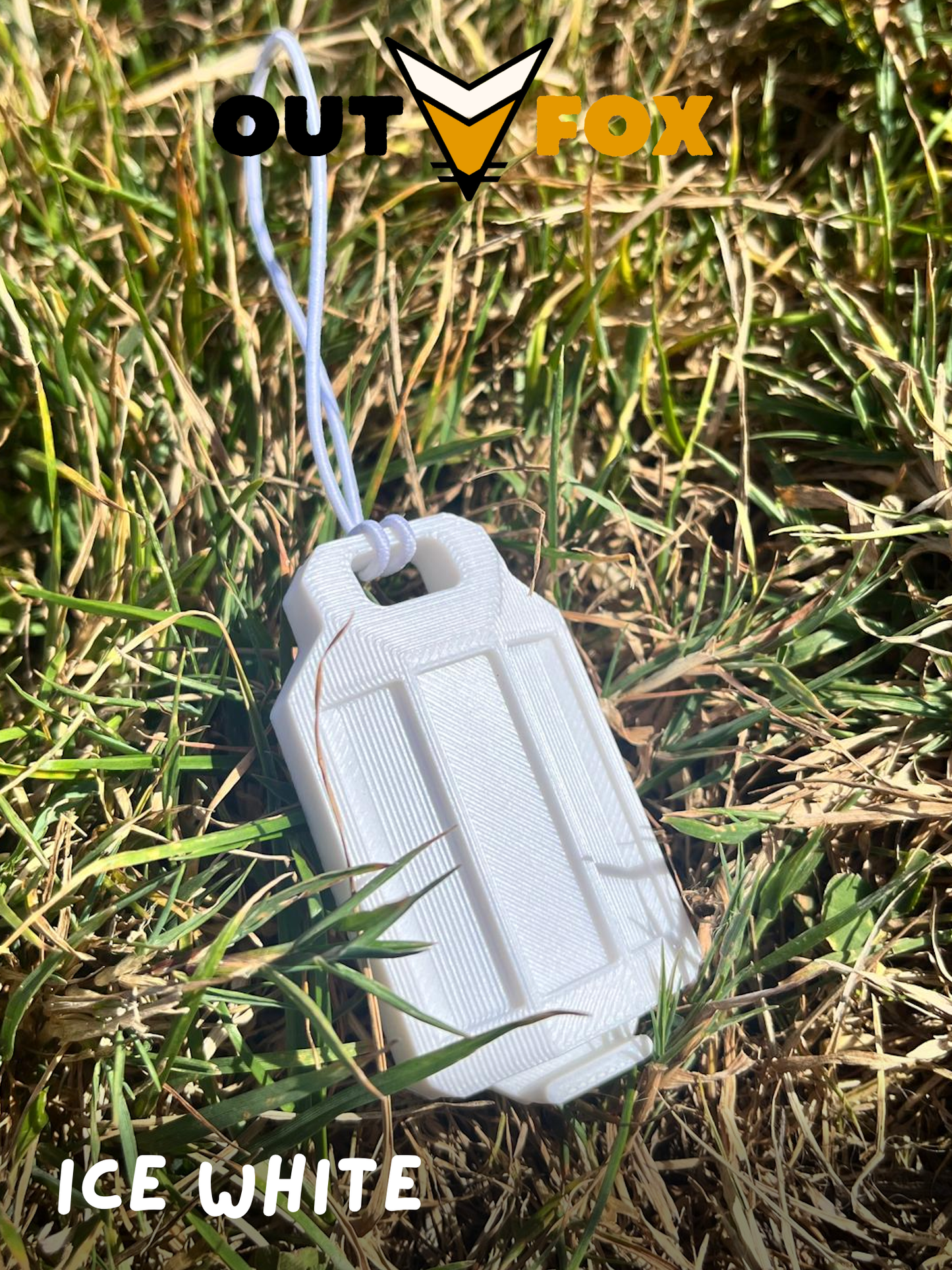 An Ice White plastic phone torch lantern attached to a phone, on a camouflage picnic blanket with OutFox branding.